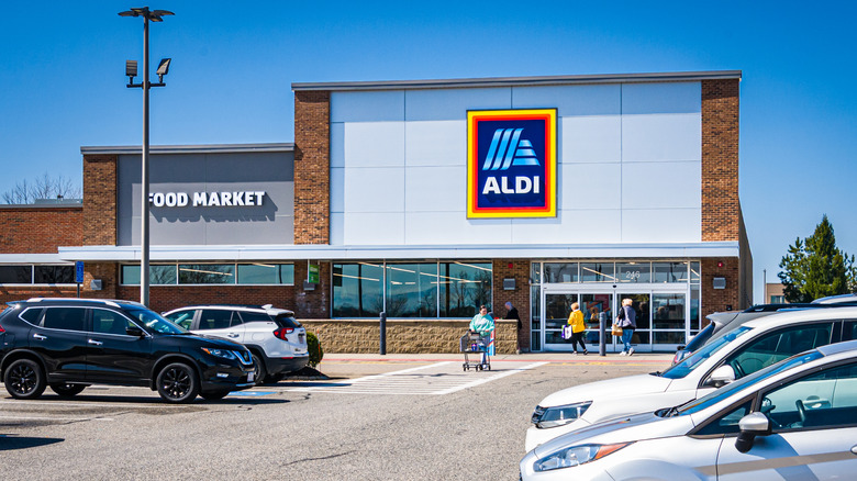 Customers entering and exiting an Aldi store